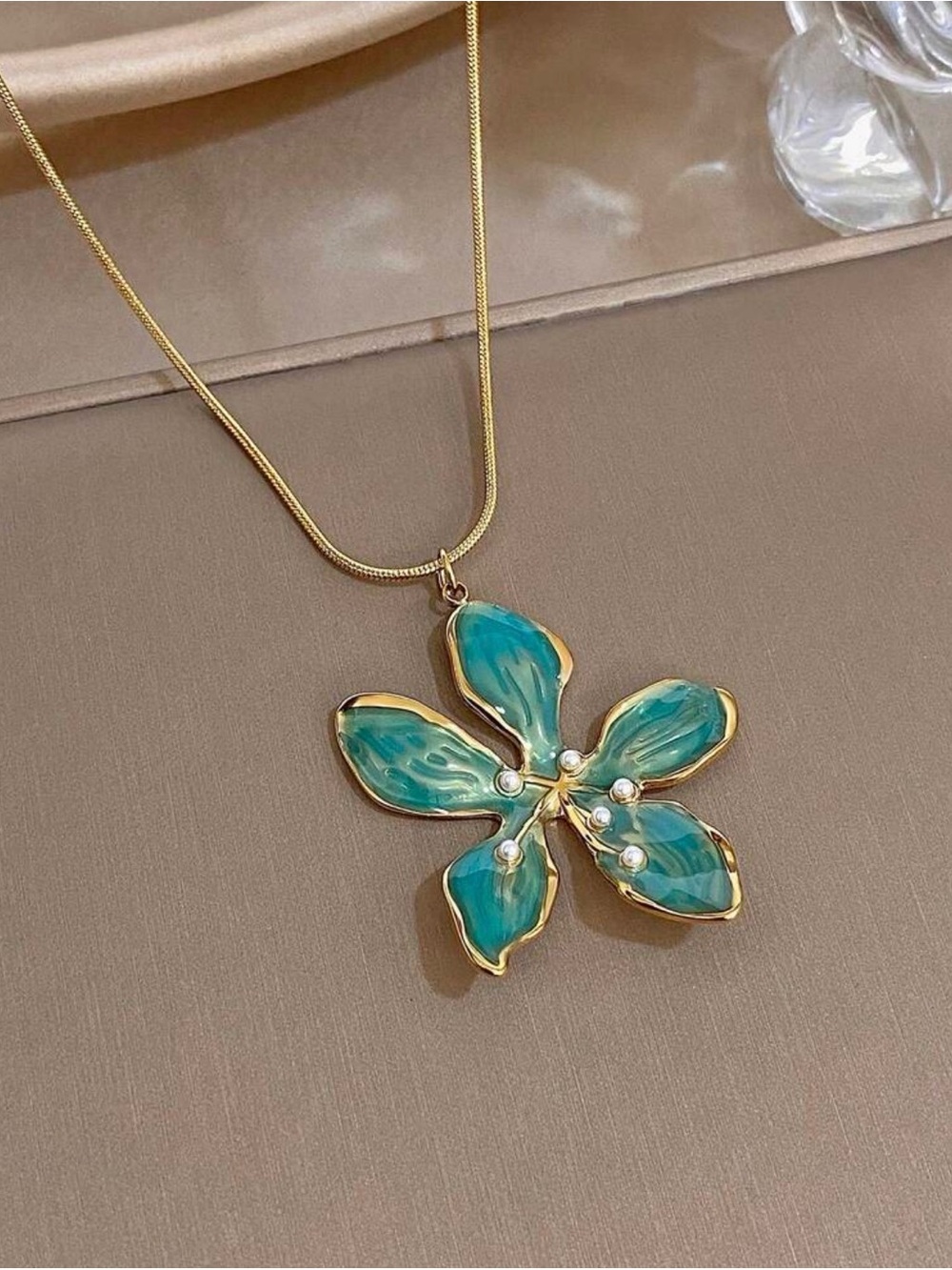 18K GOLD STATEMENT NECKLACE OVER STAINLESS STEEL